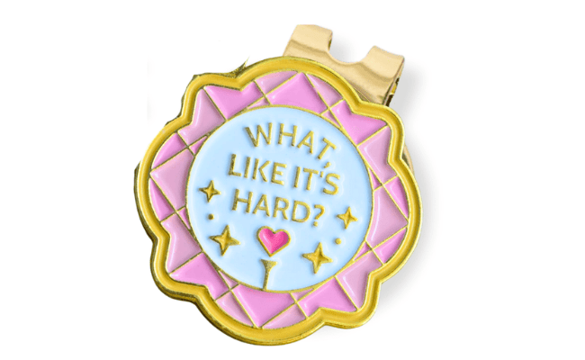 Decorative button with text 'What Like It's Hard?' on a white background