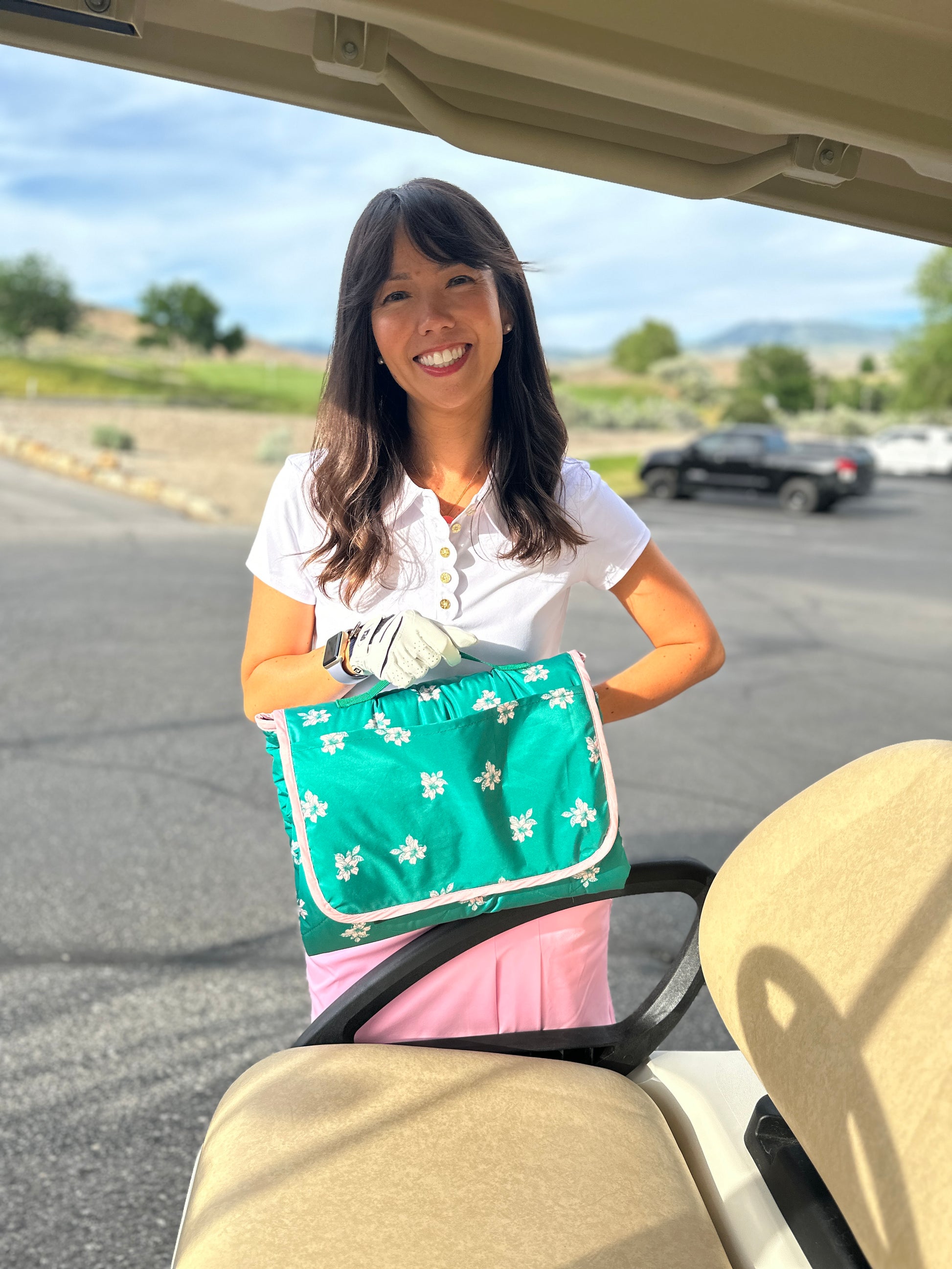 Lady holding golf cart seat cover carrying case